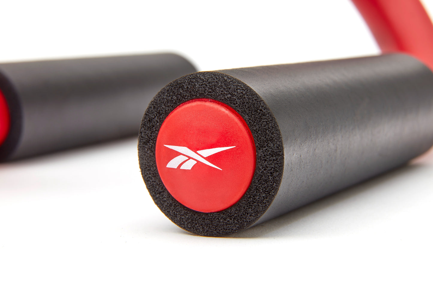barra para planchas reebok negro rojo